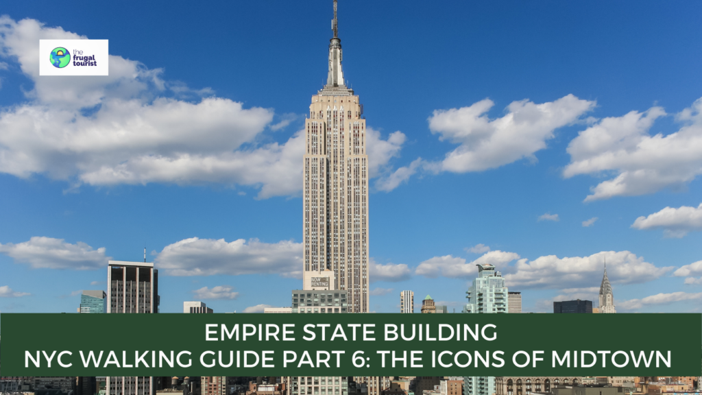 A low-angle view looking up at the towering Art Deco spire of the Empire State Building against a clear sky.